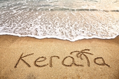 Kerala title on the sand beach near the ocean